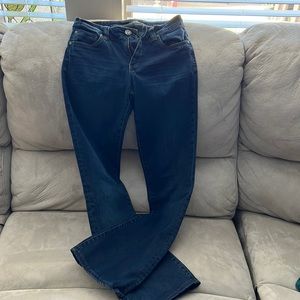 Kut from the Kloth low rise blue jeans with barely boot at legs.